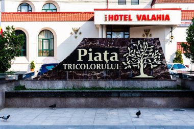 TARGOVISTE, ROMANIA - JULY 29, 2022: Tricolor square (Piata Tricolorului) from Targoviste and Valahia hotel.