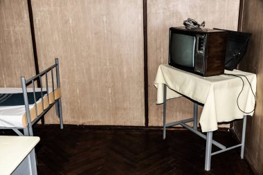 TARGOVISTE, ROMANIA - JULY 29, 2022: The decor in the place where in december 1989 the  president of Communist Romania, Nicolae Ceausescu and his wife Elena were trialed, convicted and executed.