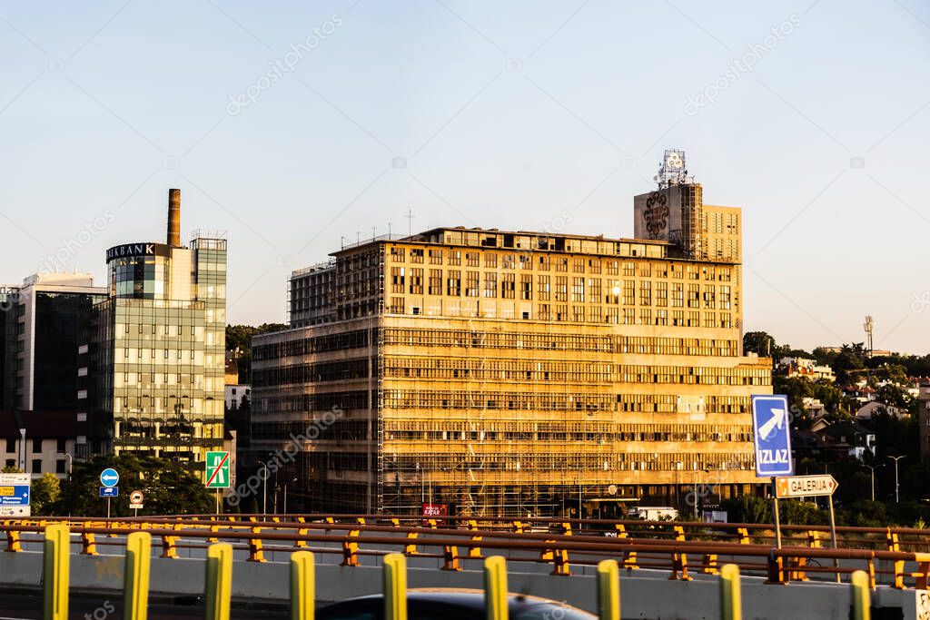 BELGRADE, SERBIA - JULY 22, 2022: BIGZ building, one of the most representative architectural landmarks of modern Serbian architecture and on the left side is the HalkBank building.
