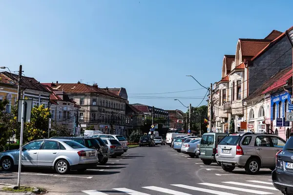stock image REGHIN, ROMANIA - JUNE 27, 2023: Buildings on Petru Maior street. Reghin city life.