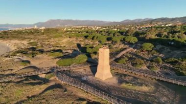 beautiful sunrise on the beach of Cabopino next to tower robbers, Marbella