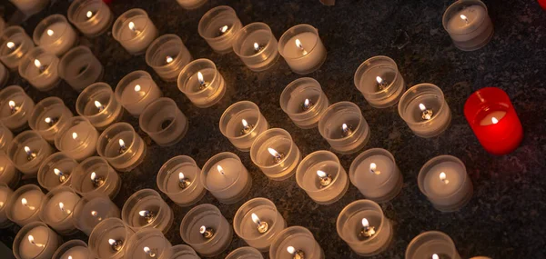 Votive candles lit in church