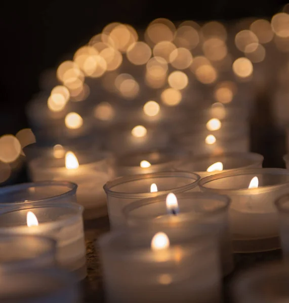 Votive candles lit in church
