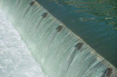 Dam with movable bulkheads on the Brembo river clipart