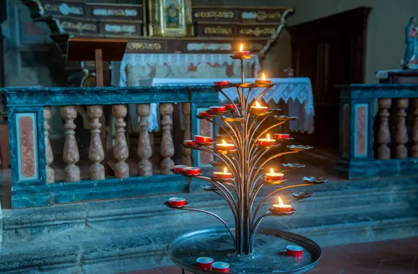 stock image Antique wrought iron candelabra with lit candles