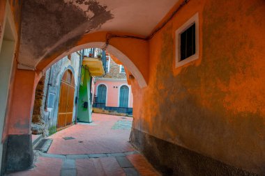 Alley of the old village of Loano in Liguria clipart