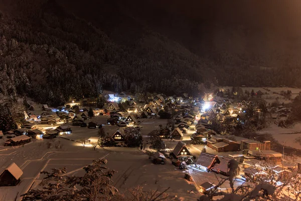 Shirakawa-gos isolated mountain village is a magical place on a snowy night, with its charming houses and beautiful lights.
