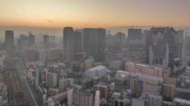 Tall buildings in Umeda district as trains arrive and depart the city.