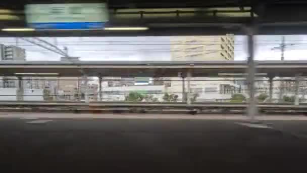 View Train Speeding Buildings Small Japanese City High Quality Footage — Vídeo de Stock
