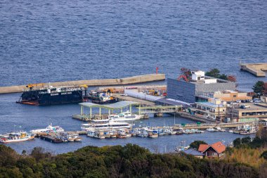 Overhead view of fishing vessels and ferries at Iwaya Port. High quality photo