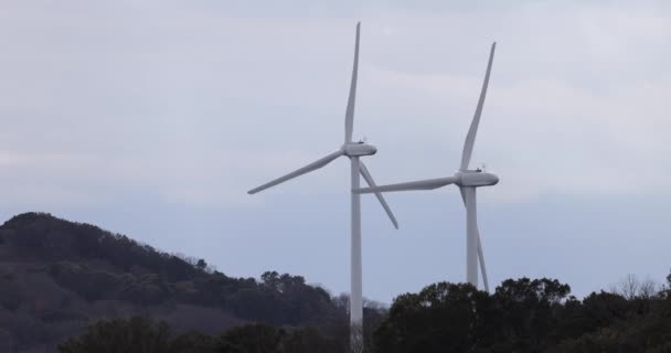 Two Wind Turbines Spinning Slow Motion Hill High Quality Footage — Wideo stockowe