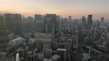Aerial View of Sky Building and Central Osaka in Haze at Sunrise. High quality 4k footage