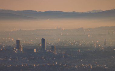 Early morning smog and haze over high rise apartments in sprawling city. High quality photo