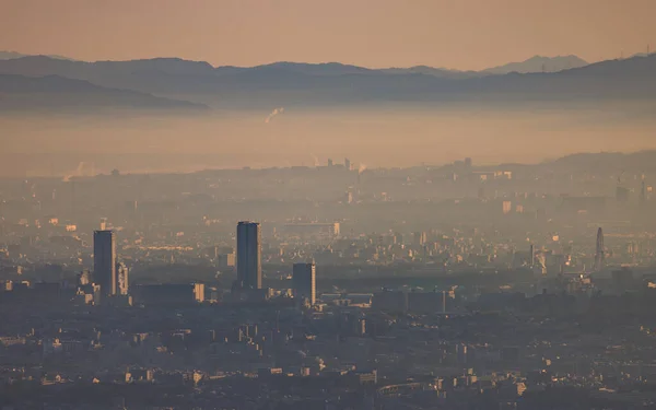 Early morning smog and haze over high rise apartments in sprawling city. High quality photo