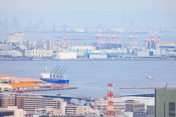 Cargo Ship Docked Kobe Port Loading Cranes City Skyline Distance — Stock Photo, Image