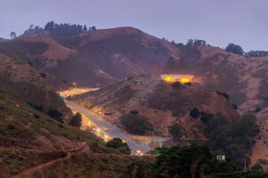 Early morning traffic on El Camino Real approaching Robin Williams Tunnel. High quality photo clipart