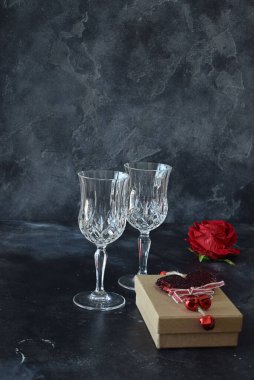 Valentine background with wine, roses and beautiful gifts. 