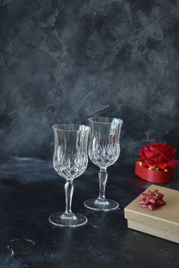 Valentine background with wine, roses and beautiful gifts. 