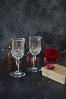 Valentine background with wine, roses and beautiful gifts. 