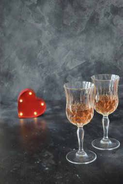 Valentine background with wine, roses and beautiful gift. 