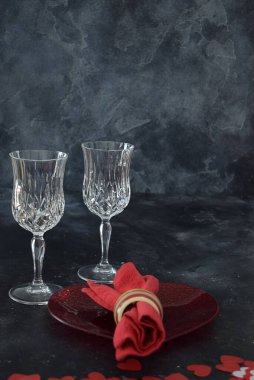 Valentines dinner with red wine, in a romantic background.