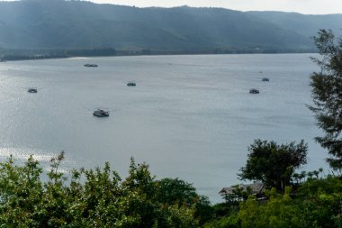 Aerial view of traditional fisherman boats at the sea. Fishing boat sailing in open water near Malahayati port at Aceh Besar, Indonesai