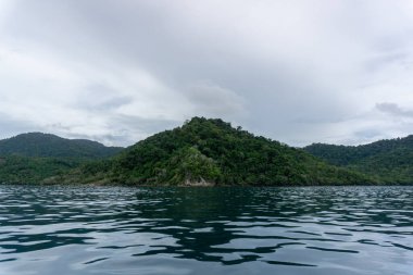 Beautiful landcape of Sabang Island in Sumatera Indonesia. Island view from the boat. Landscape of Weh island and Rubiah island clipart