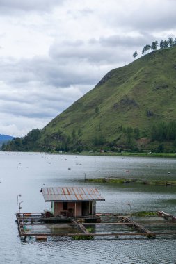 Landscape of Laut Tawar lake in Takengon city, Indonesia. Popular tourist destination in Central Aceh. clipart