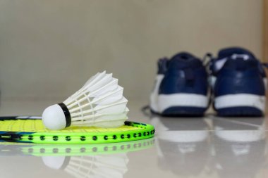 Badminton rackets, shuttlecocks and shoes. Concept of badminton equipment clipart