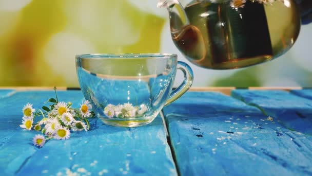Slow Motion Pour Chamomile Tea Cup Wooden Blue Table Fragrant — Stock Video