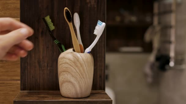Pick Toothbrush Bathroom Man Takes Wooden Eco Toothbrush His Hand — Stock Video