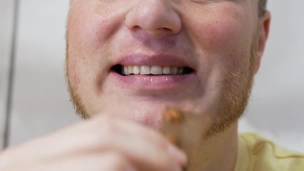 Man Beautiful Smile Eats Appetizing Chocolate Nut Portrait Man Eating — Stock Video