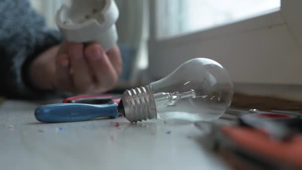 Electrician Connects Light Bulb Socket Close Electric Light Bulb Workbench — Stock Video