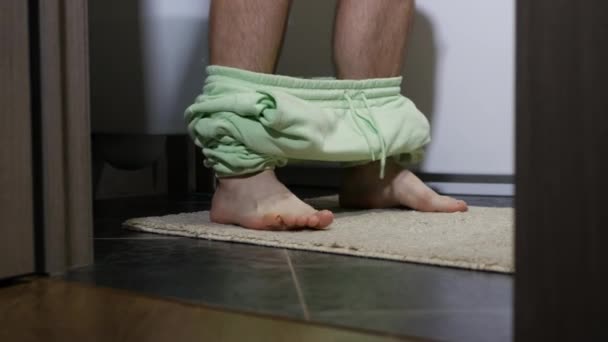 Man Lowering His Pants Toilet Sitting Toilet Has Diarrhea Bloating — Stock Video
