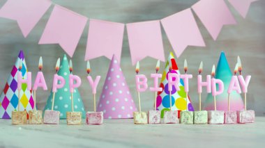 Close-up copy space for the name of the birthday boy or girl. Happy birthday card with colorful decorations for a girl or woman on her birthday