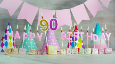 Happy birthday number 90 in pink pastel colors for a girl or woman. Happy birthday greeting card