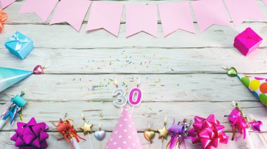 Happy birthday number 30. Copyspace. Beautiful card in pastel pink colors for a woman or a girl. Decorations festive place for your text