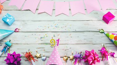 Happy birthday number 91. Copyspace. Beautiful card in pastel pink colors for a woman or a girl. Decorations festive place for your text