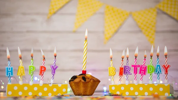 Festive card Happy Birthday with number of burning candles. Beautiful background copy space, happy birthday