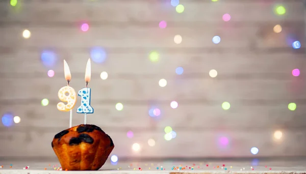 Happy birthday background with muffin and number of candles on light bulbs bokeh background. Greeting card happy birthday copy space with number 91