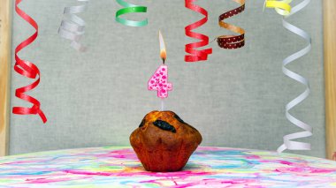 Happy birthday background with muffin with beautiful decorations with number candles  4. Colorful festive card happy birthday with a number. Anniversary copy space