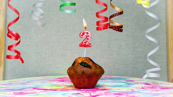 Happy birthday background with muffin with beautiful decorations with number candles  2. Colorful festive card happy birthday with a number. Anniversary copy space