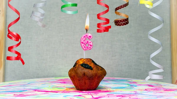Happy birthday background with muffin with beautiful decorations with number candles  6. Colorful festive card happy birthday with a number. Anniversary copy space