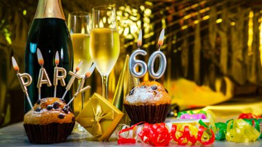 Happy birthday background with champagne glasses with number cake  60. Beautiful birthday card with decorations copy space.