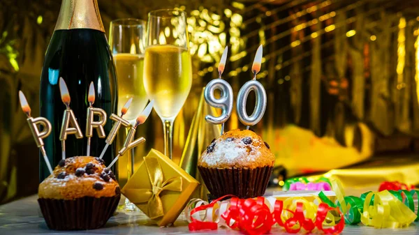Happy birthday background with champagne glasses with number cake  90. Beautiful birthday card with decorations copy space.
