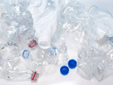 Empty twisted plastic bottles. Used plastic bottles trash. Caring for ecology concept.