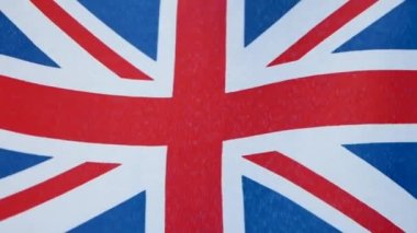 Yakın plan, İngiltere Bayrağı rüzgarda, Britanya bayrağı. Büyük Britanya Birleşik Krallığı bayrağı rüzgarda dalgalanır.