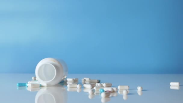 Medical Jar Pills White Table Blue Background Medical Capsules Antistress — Vídeo de Stock