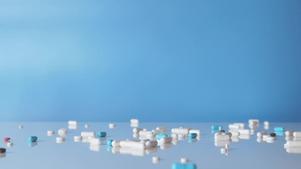 Medical Jar Lot Pills White Table Blue Background Medical Capsules — Stockvideo