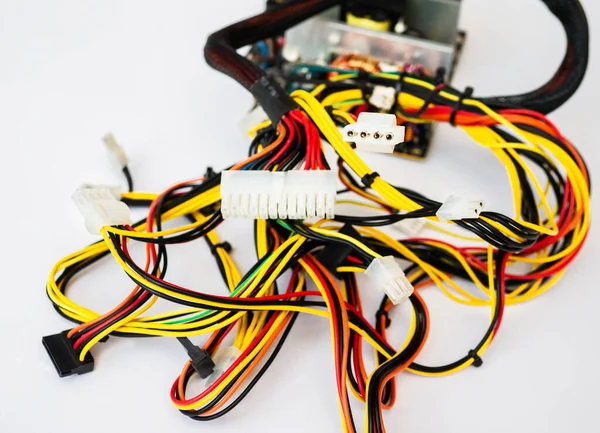 Multi-colored computer wires with white connectors on a white background. Connector, pin wired plug for Radioelectronics